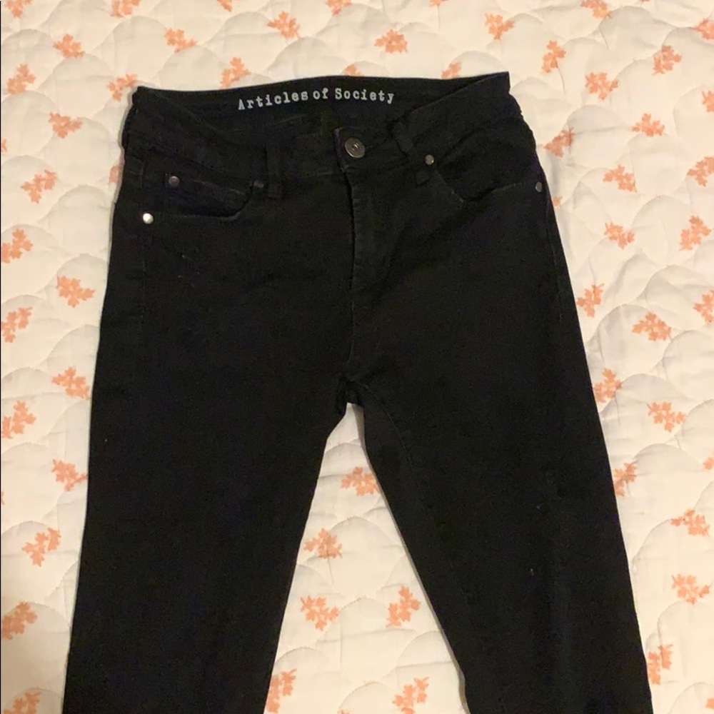 Distressed skinny black jeans